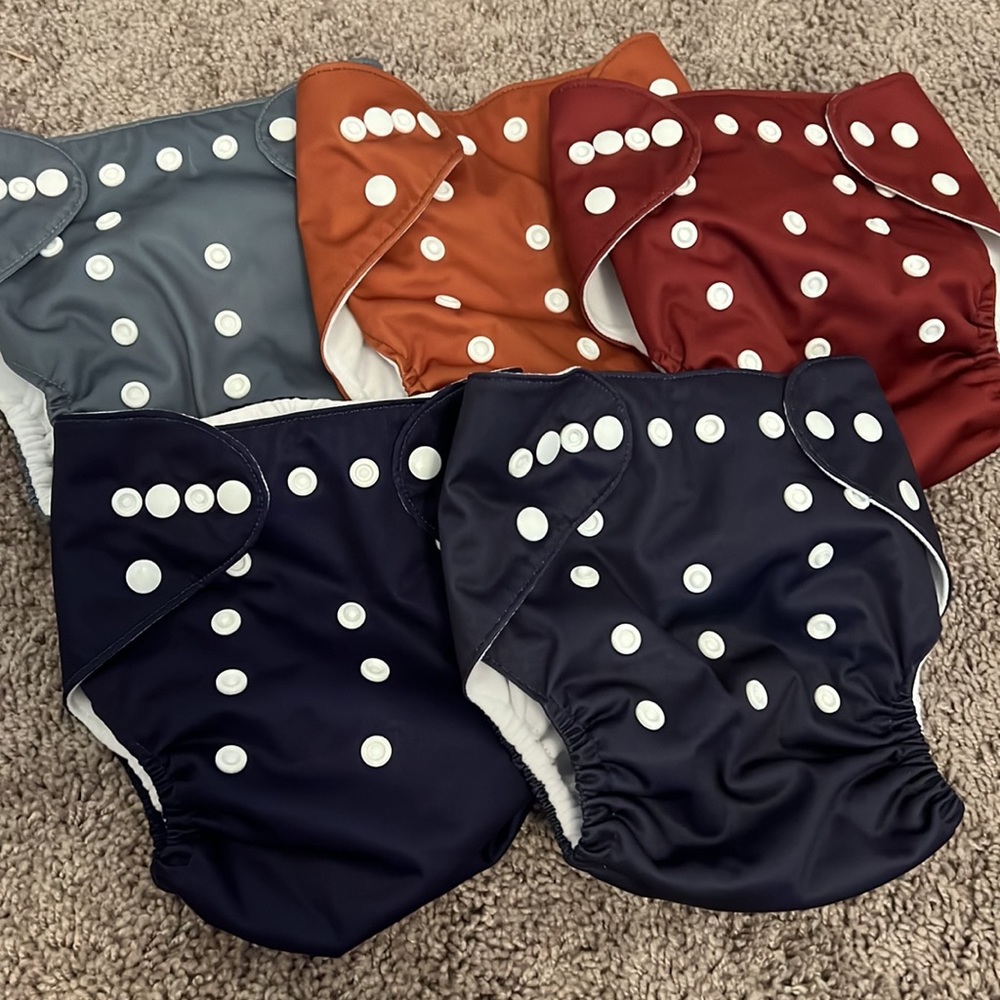 5 reusable cloth diaper covers + Inserts